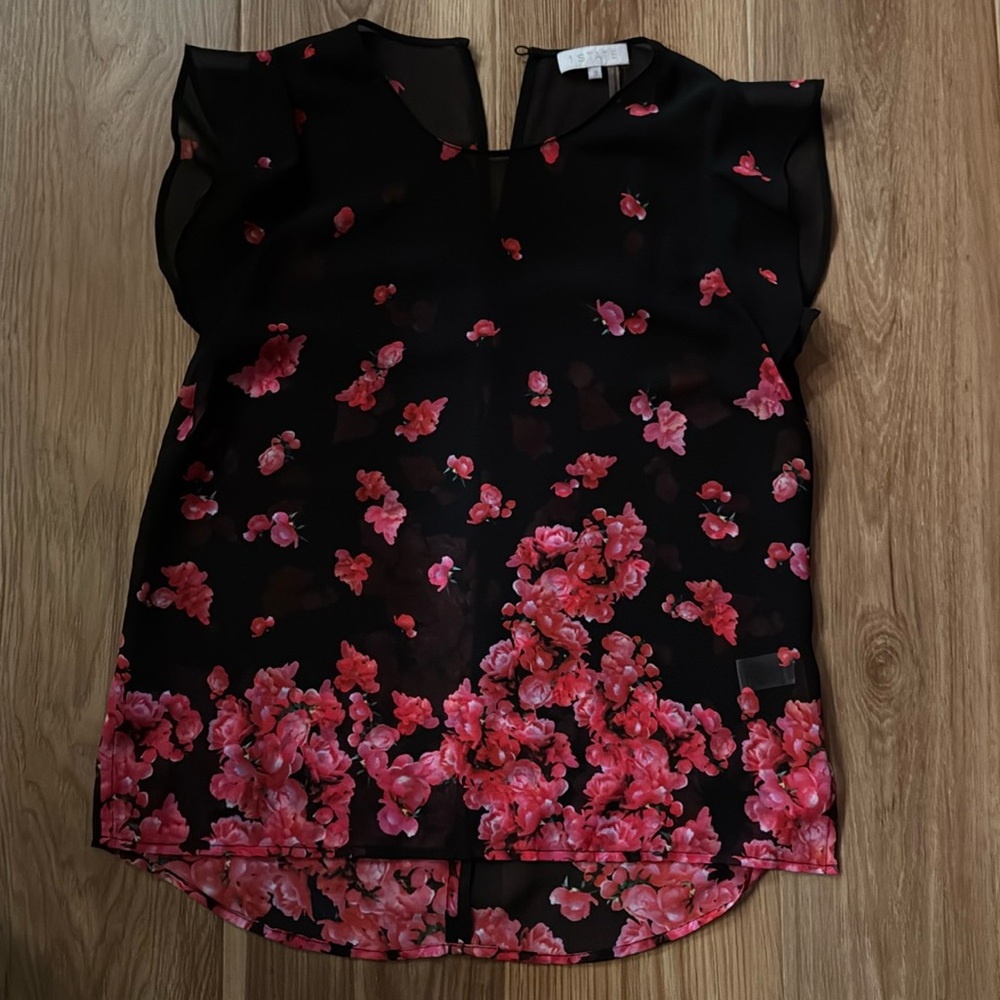 Sheer black top with pretty flowers. Size S.